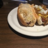Pictured here are two of T & D Coney Grill's coney dogs. The left is topped with sauerkraut, mustard and onion. The right is topped with chili, mustard, and onion. Photo by Jamal Tyler.